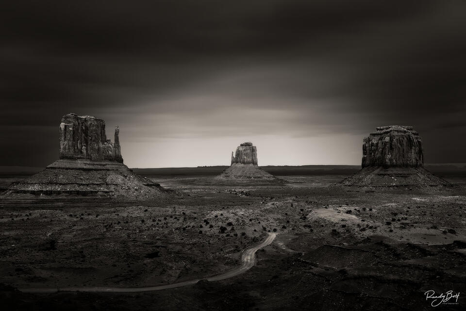 black and white long exposure image of Monument Valley