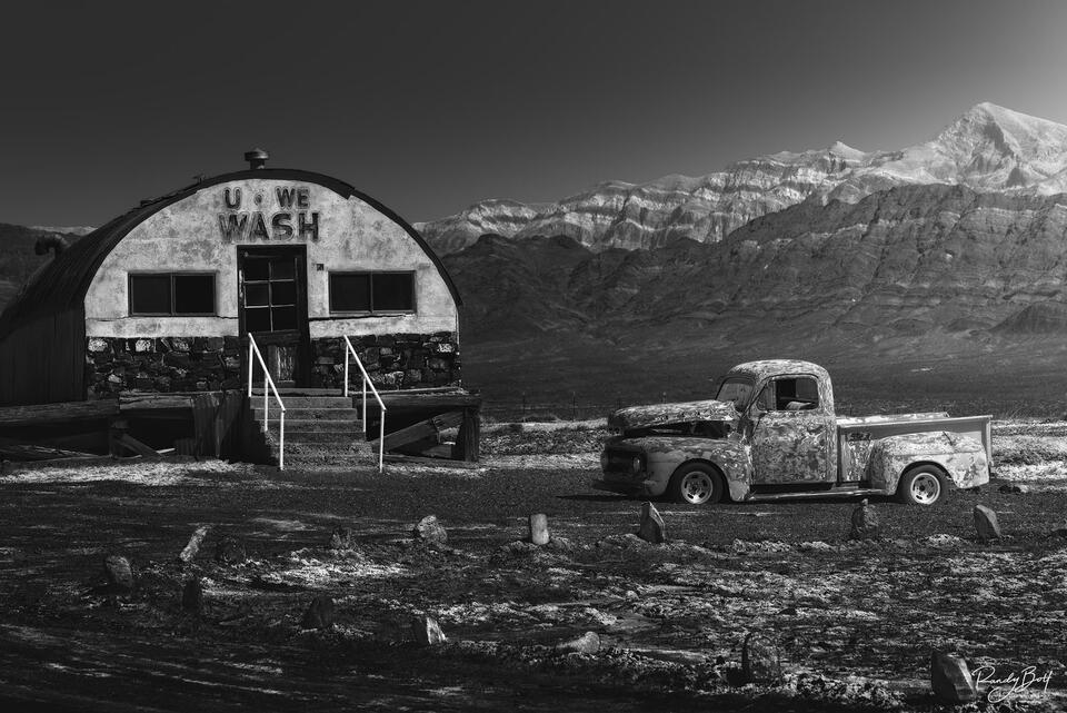 black and white fine art image of the Tecopa U-WE Wash and old truck